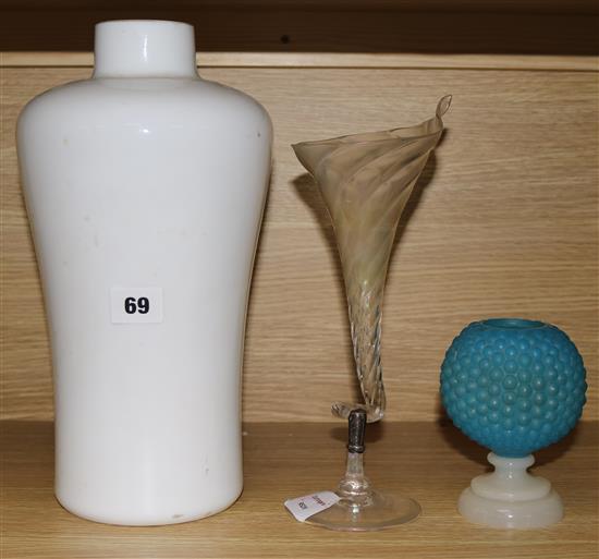 An opaque white glass lamp and two glass vases